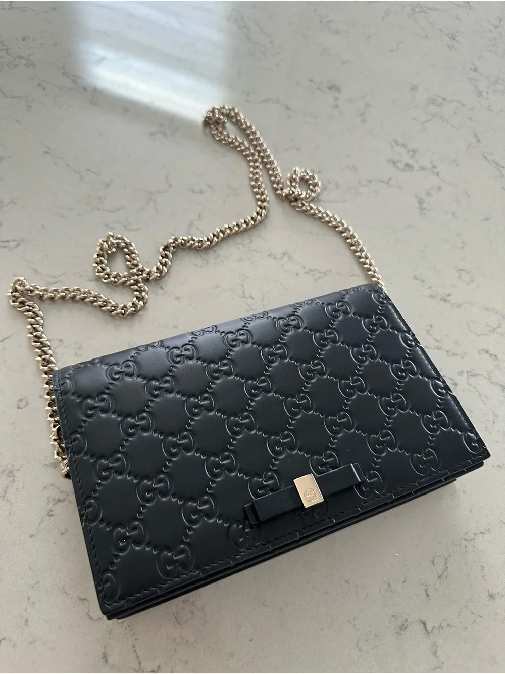 Authentic Gucci Black Embossed Leather Chain Wallet with Bow Accent